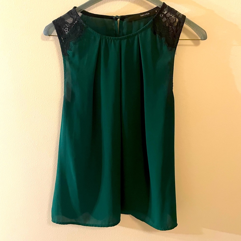 100% polyester tank top blouse with perfect black lace shoulder detail.